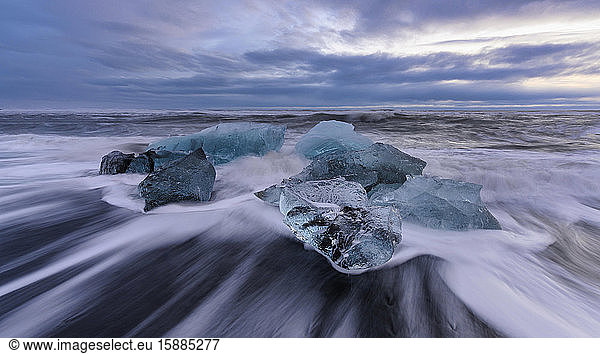 Iceland  Ice chunks lying at shore of Jokulsarlon at dusk