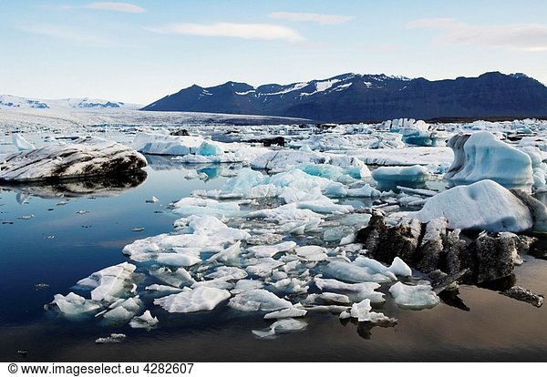 Iceland  Jokulsarlon glacier  icebergs floating on water.