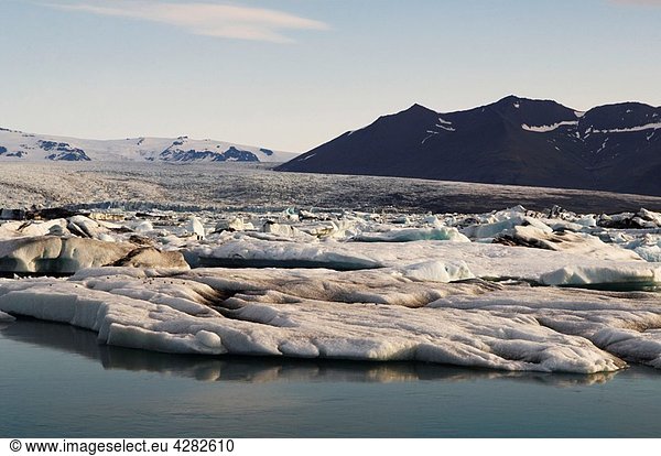 Iceland  Jokulsarlon glacier  icebergs floating on water.