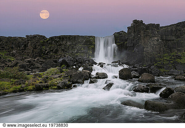 Iceland  Sudurland  Long exposure of Oxararfoss waterfall at dusk