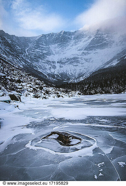 Icy frozen Chimney Pond in winter  Baxter State Park  Katahdin  Maine