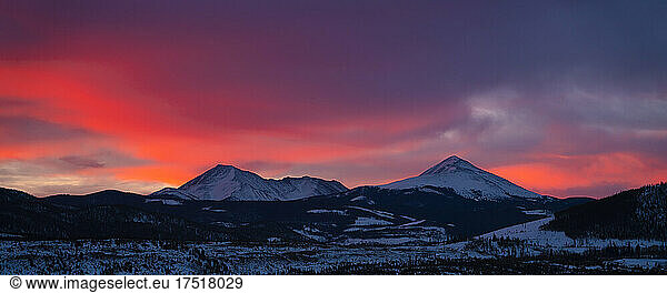 Idyllic shot of mountain range against orange sky during sunrise