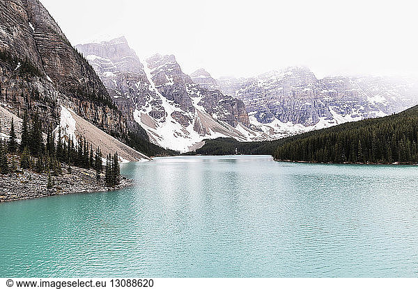 Idyllic view of Moraine Lake against mountain ranges and clear sky