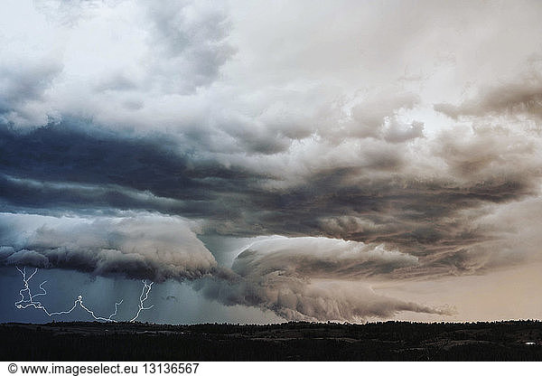 Idyllic view of thunderstorm lightning over landscape