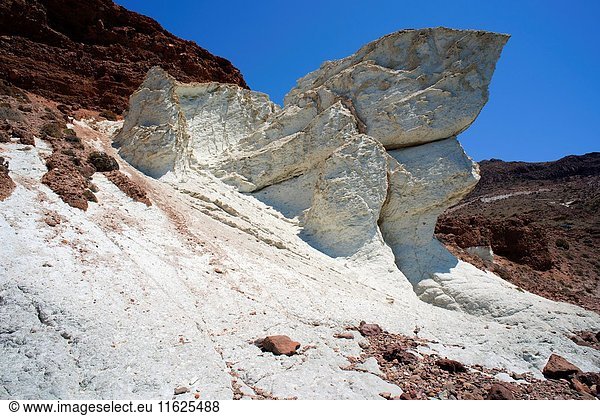 Ignimbrite (white rocks) in Cala Raja  Cabo de Gata  Almeria  Andalusia  Spain. Ignimbrite is a volcanic rock formed from a deposit of pyroclastic flow.