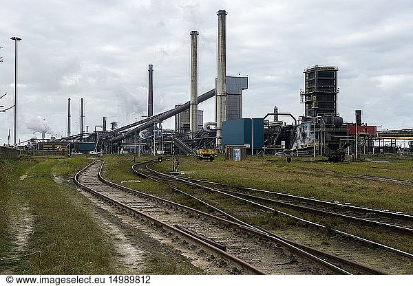 IJmuiden  Netherlands. Huge  heavy steel production plant and industry terrain  producing various kinds of steel inside an CO2 emitting factory. The steel plant is called Hoogovens and is owned by Tata Steel  an international corporation  who also suffers from decline in revenues and ever increasing demands on corporate responsibility  regarding labour and climate.