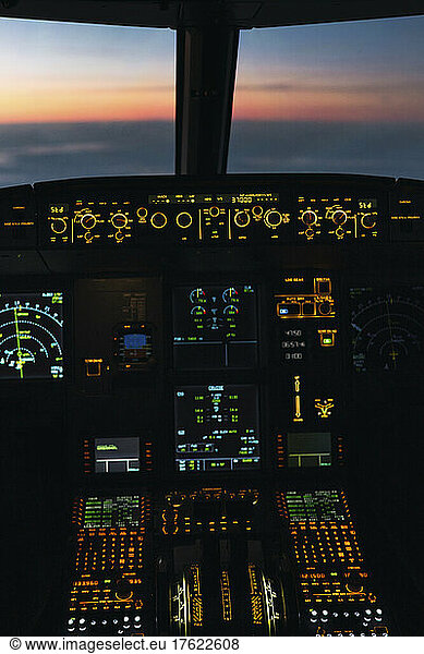 Illuminated control panel in airplane cockpit