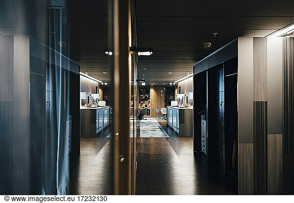Illuminated corridor in corporate office