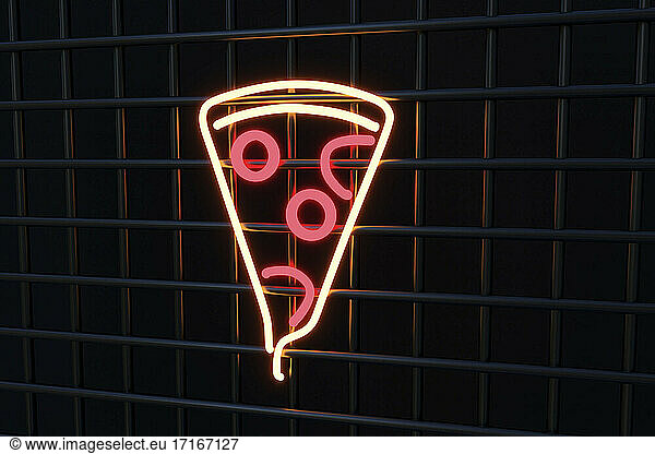 Illuminated pizza sign on black metal grate