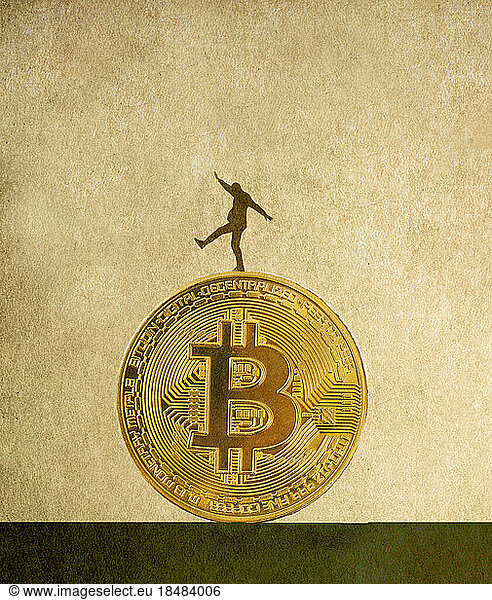 Illustration of man balancing on top of large Bitcoin