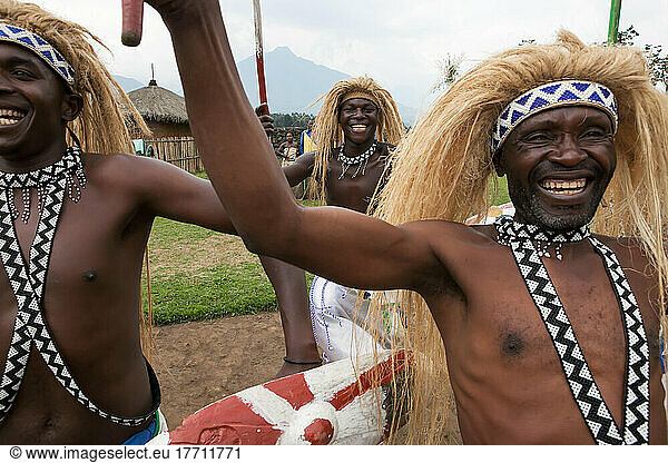 In a small village  men dress as warriors and perform traditional dance.; Volcanoes National Park  Rwanda