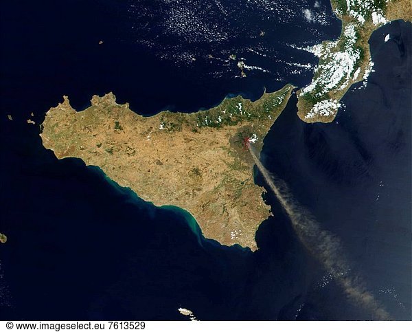 In northeastern Sicily  Mt. Etna continues to erupt. NASA satellite captured this true_color image of the volcano on July 22  2001. The eruption has opened five vents in the mountain  and is releasing a cloud of ash that can be seen stretching southeastward over the Mediterranean Sea. The red box overlaid on Mt. Etna shows where the satellite detected heat escaping from the volcano. Mt. Etna has a complex and asymmetrical shape because it did not grow from a single large cone  but rather as a series of volcanic openings that were created and then collapsed on themselves over time. Today the mountain is dotted with hundreds of minor pyroclastic cones  built from the debris of previous eruptions  as well as numerous eruptive cones and large fissures  or cracks. The current eruption includes an explosive fissure along the south flank of the mountain  and lava is creeping its way toward the town of Nicolosi. Local citizens have a long history of living with the volcano  and continue to farm on its flanks and in its shadow despite the volcanic and seismic danger because of the favorable climate and fertile soils. In the past  they have used earthen barriers to direct lava flows away from some towns  even going so far as to detonate explosions in the hopes of creating new channels through which the lava could flow.