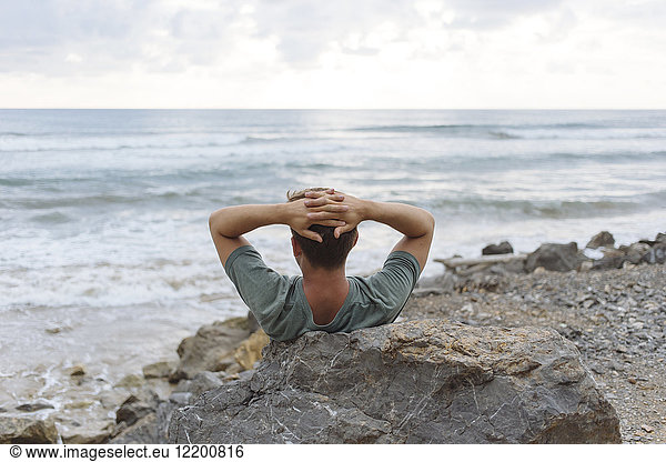 Indonesia, Sumatra, young man at ocean coastline, Indonesia, Sumatra, young man at ocean coastline