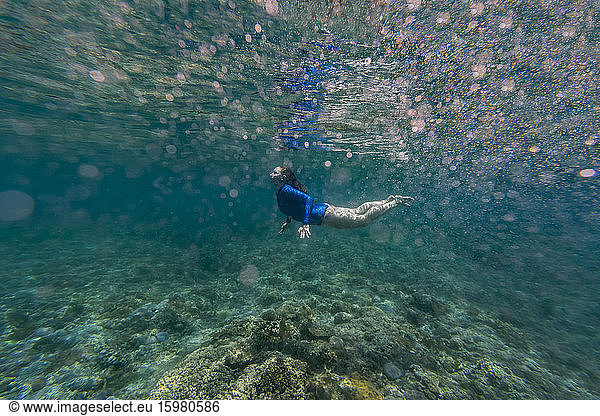 Indonesia  Bali  Young woman snorkeling in Nusa Penida island