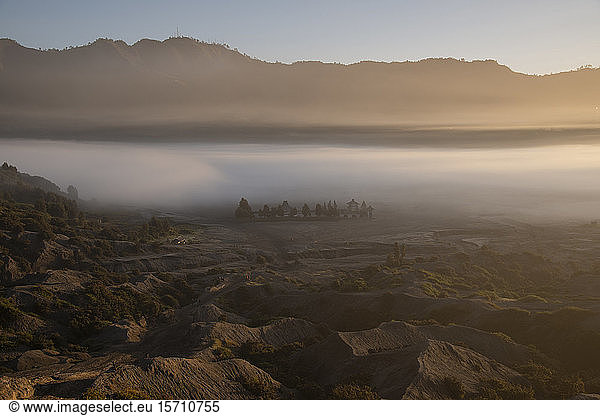 Indonesia  East Java  Thick morning fog shrouding valley in Bromo Tengger Semeru National Park