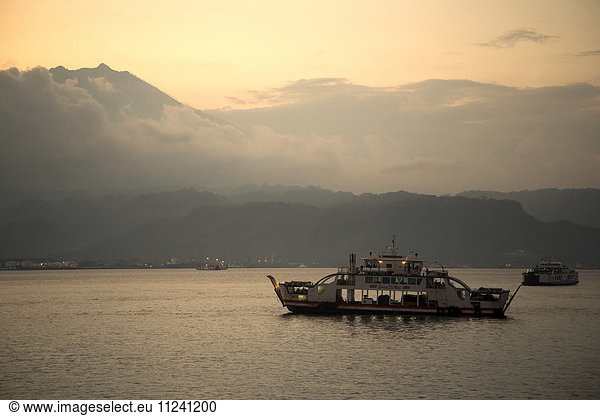 Indonesia  ferry between Bali and Java at twilight