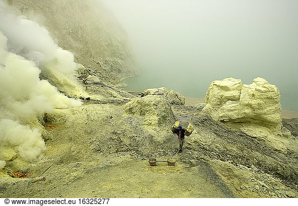 Indonesia  Java  Sulphur miners working in the crater at Kawah Ijen