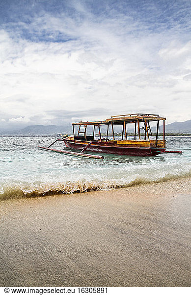 Indonesia  Lombok  Isle Gili Air  traditional wooden boat at beach