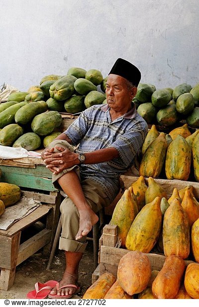 INDONESIA Man selling papayas  Banda Aceh  Aceh  2 years after the Tsunami