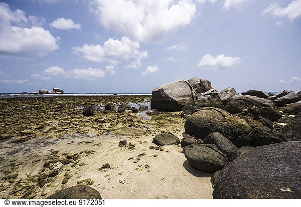 Indonesia Riau Islands Bintan Nikoi Island Beach with granite blocks