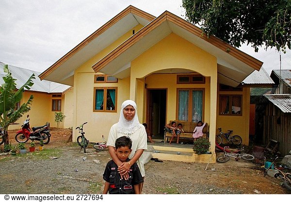 INDONESIA The house of Fitriah in Rima Jeuna With her nephew Amalul 8 Banda Aceh  Aceh  two years after the Tsunami