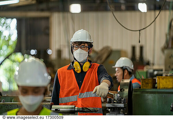 Industrial factory employee wearing protection face mask
