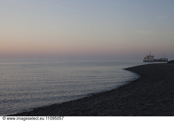 Industrial ship in sea during sunset  Renesse  Schouwen-Duiveland  Zeeland  Netherlands