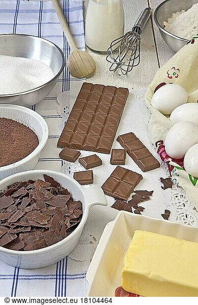 Ingredients for chocolate muffins  cocoa powder  grated chocolate  milk chocolate  eggs  butter  flour  sugar  chocolate biscuits  cocoa  bake