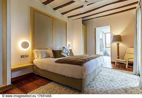 Interior of illuminated luxurious bedroom at hotel