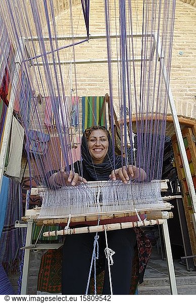 Iranian woman weaving a carpet  Caravanserai  Meybod  Yazd Province  Iran  Asia
