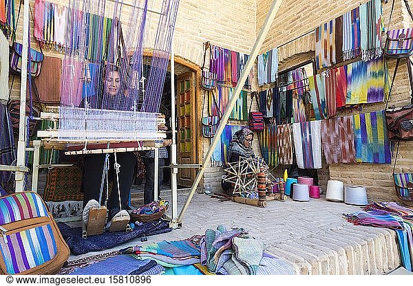 Iranian woman weaving a carpet  Caravanserai  Meybod  Yazd Province  Iran  Asia