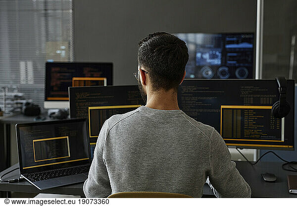 IT professional using computer in office