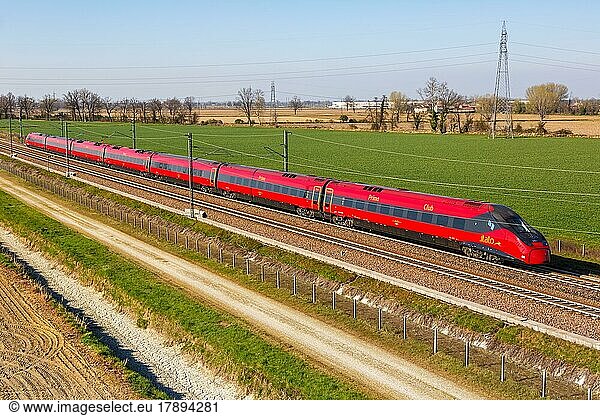 Italo ETR 675 Pendolino high speed train of Nuovo Trasporto Viaggiatori NTV on the route Milan  Bologna near Melegnano in Italy