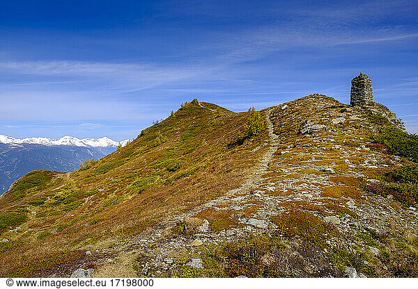Italy  Footpath leading to brown mountain peak in Dolomites