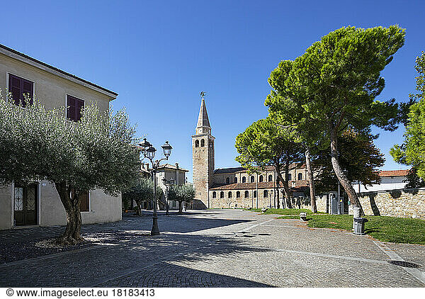 Italy  Friuli Venezia Giulia  Grado  Empty town square with Basilica of Sant Eufemia in background