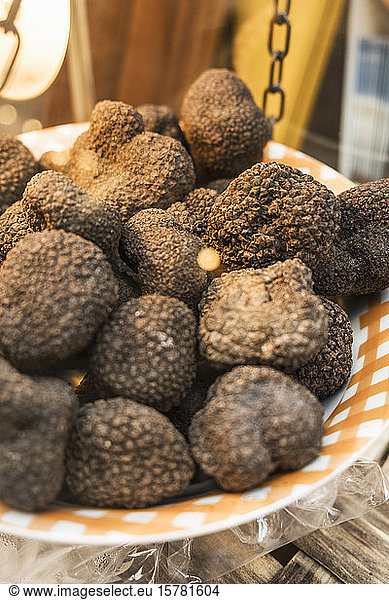 Italy  Heap of black truffles (Tuber melanosporum) on weight scale of local market