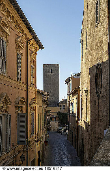 Italy  Lazio  Tarquinia  Historic houses with old tower in background