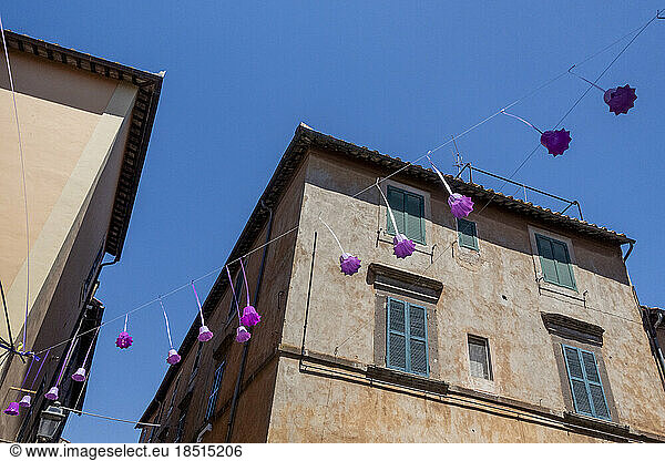 Italy  Lazio  Tuscania  Bell-shaped festival decorations hanging in front of house