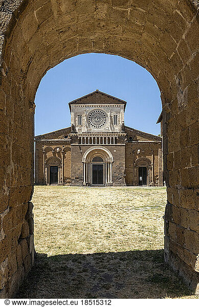 Italy  Lazio  Tuscania  Facade of San Pietro church with arched entrance in foreground
