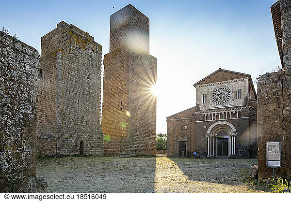 Italy  Lazio  Tuscania  Facade of San Pietro church with sun shining in background
