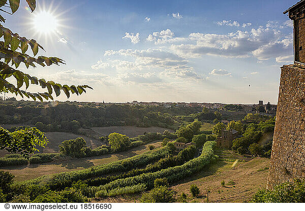 Italy  Lazio  Tuscania  Summer sun shining over rural landscape seen from San Pietro church