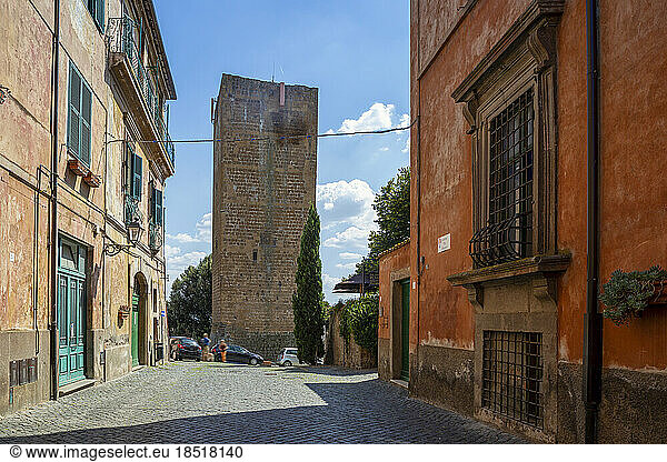 Italy  Lazio  Tuscania  Torre di Lavello in summer with town houses in foreground