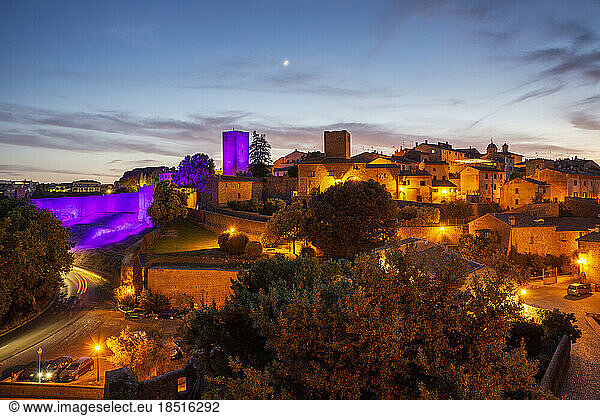 Italy  Lazio  Tuscania  View of Torre di Lavello illuminated by purple light at dusk