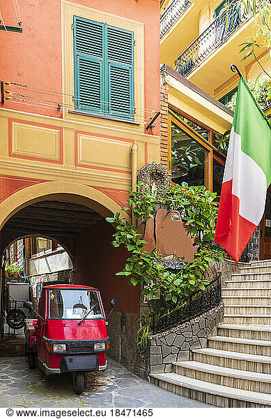 Italy  Liguria  Monterosso al Mare  Piaggio Ape riding through arched alley