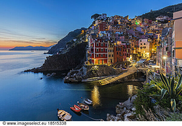Italy  Liguria  Riomaggiore  Edge of coastal village along Cinque Terre at dusk