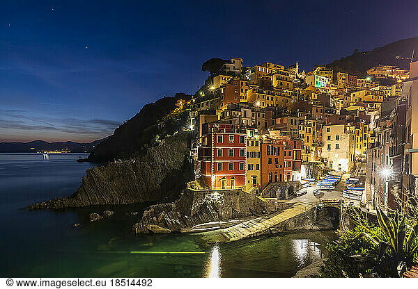 Italy  Liguria  Riomaggiore  Edge of coastal village along Cinque Terre at night