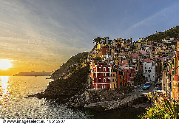 Italy  Liguria  Riomaggiore  Edge of coastal village along Cinque Terre at sunset