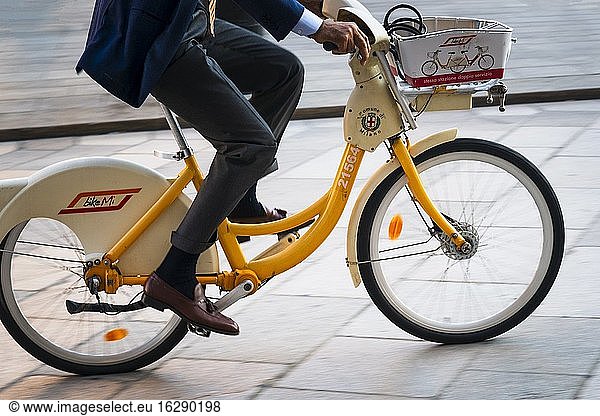 Italy  Lombardy  Milan  Businessman Riding on a Rental Bike.