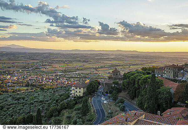 Italy  Province of Arezzo  Cortona  View of town overlooking Chiana Valley at dusk