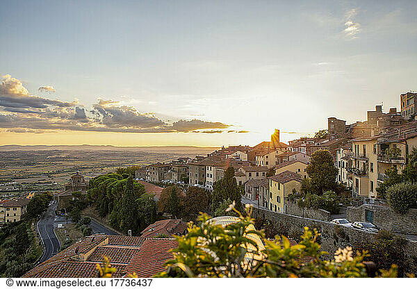 Italy  Province of Arezzo  Cortona  View of town overlooking Chiana Valley at sunset